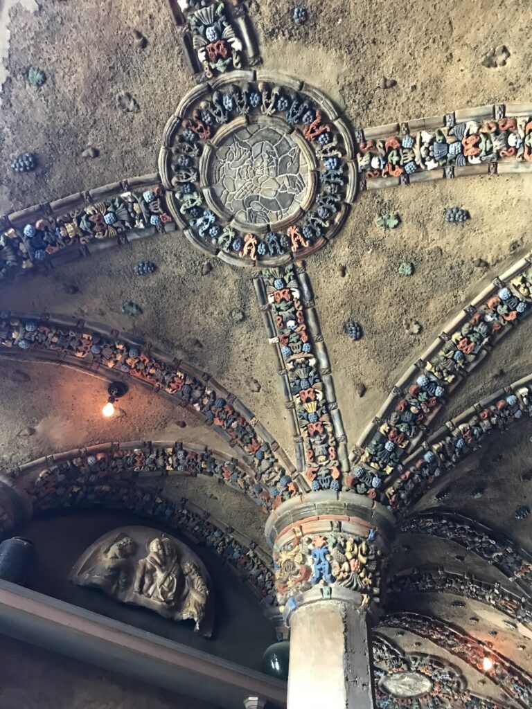 Decorative vaulted ceiling at Fonthill Castle featuring intricate colorful tilework and sculpted medallions