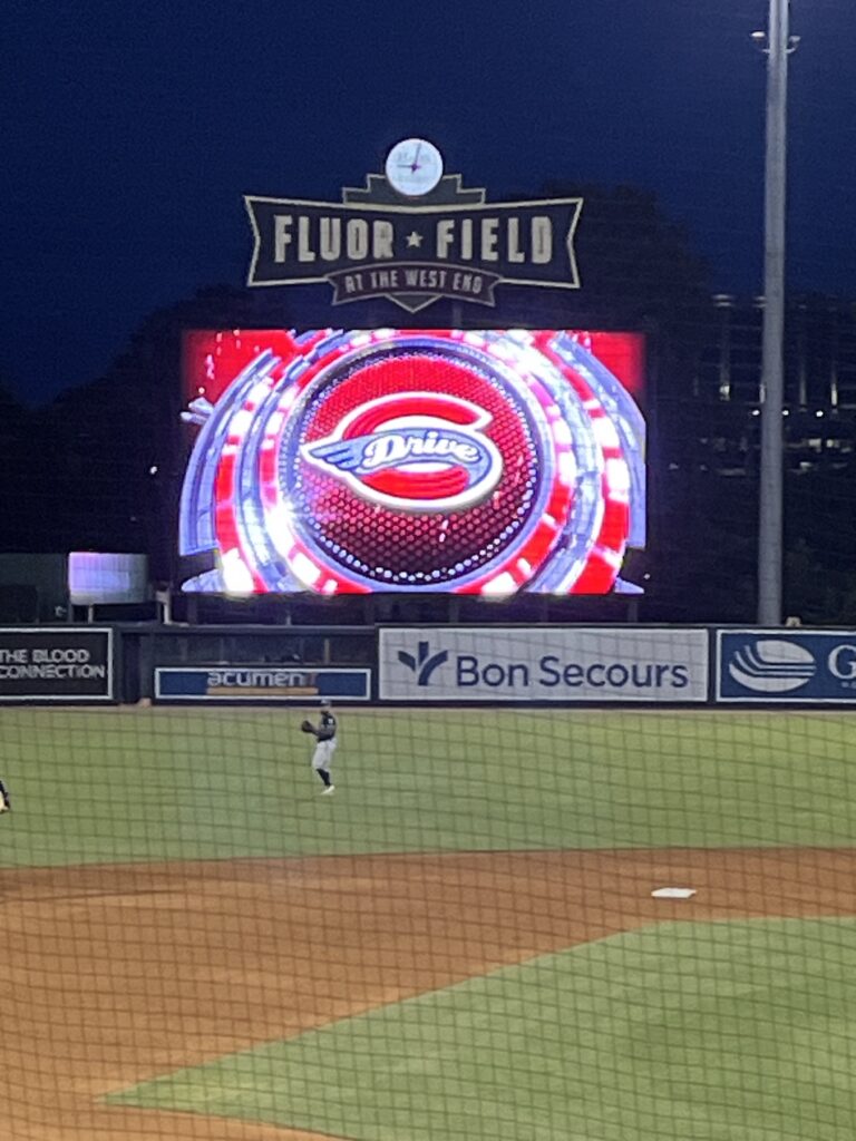 Scoreboard at Fluor Field in Greenville South Carolina during a baseball game at night