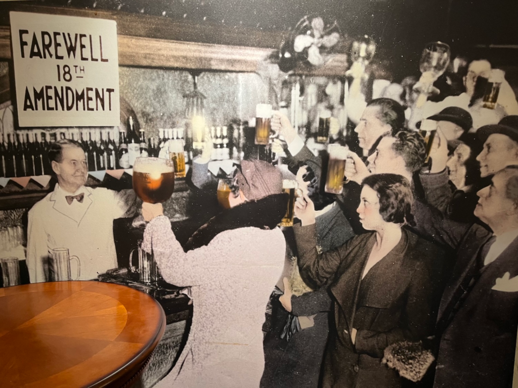 Historic photo celebrating the end of Prohibition with raised beer mugs