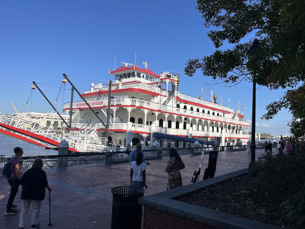 The Georgia Queen riverboat docked along Savannah Riverwalk on a sunny day
