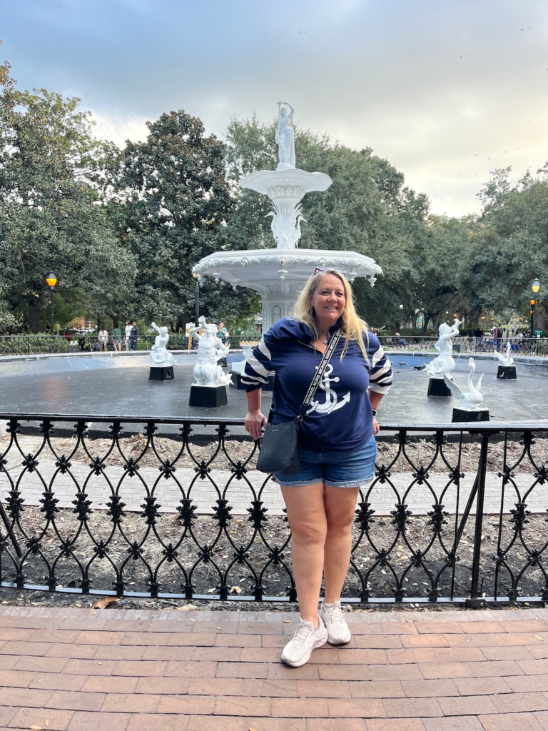 Woman posing in front of the Forsyth Park Fountain in Savannah, Georgia