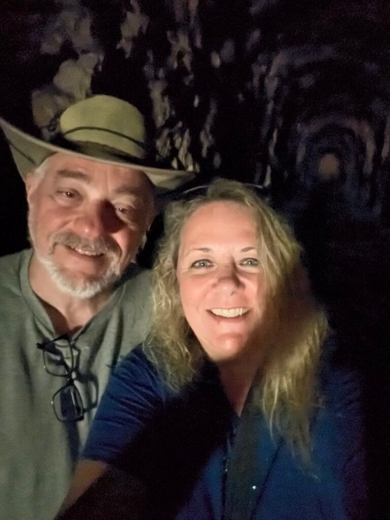 Travel bloggers exploring Stumphouse Tunnel in Walhalla, South Carolina.