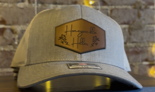 Honeysuckle Holler branded hat displayed inside the popular dance hall and entertainment venue in Hendersonville, North Carolina.