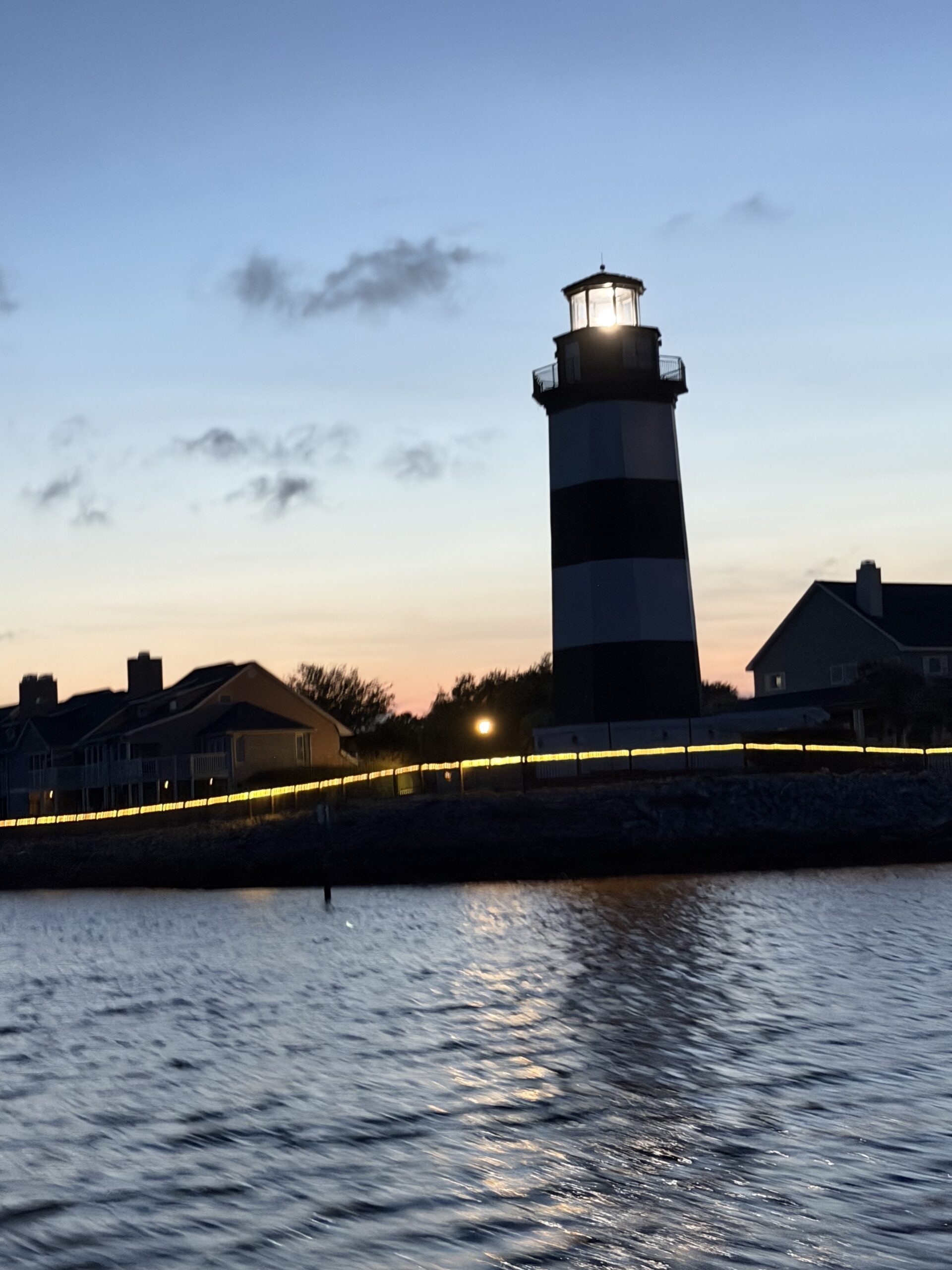 Governor's Lighthouse glowing at dusk along the Intracoastal Waterway near Little River, South Carolina.