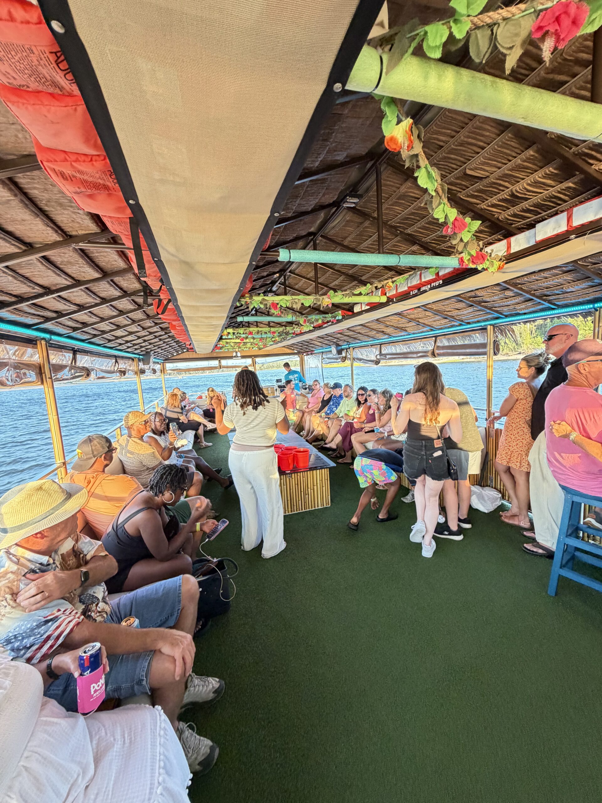 Passengers relaxing aboard the PonTiki party boat during a sunset cruise in Myrtle Beach.