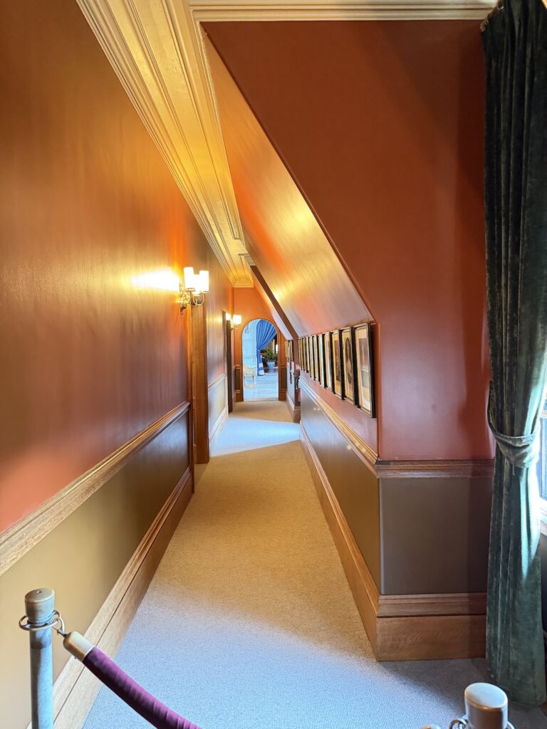 Portrait-lined corridor on Biltmore House's attic level