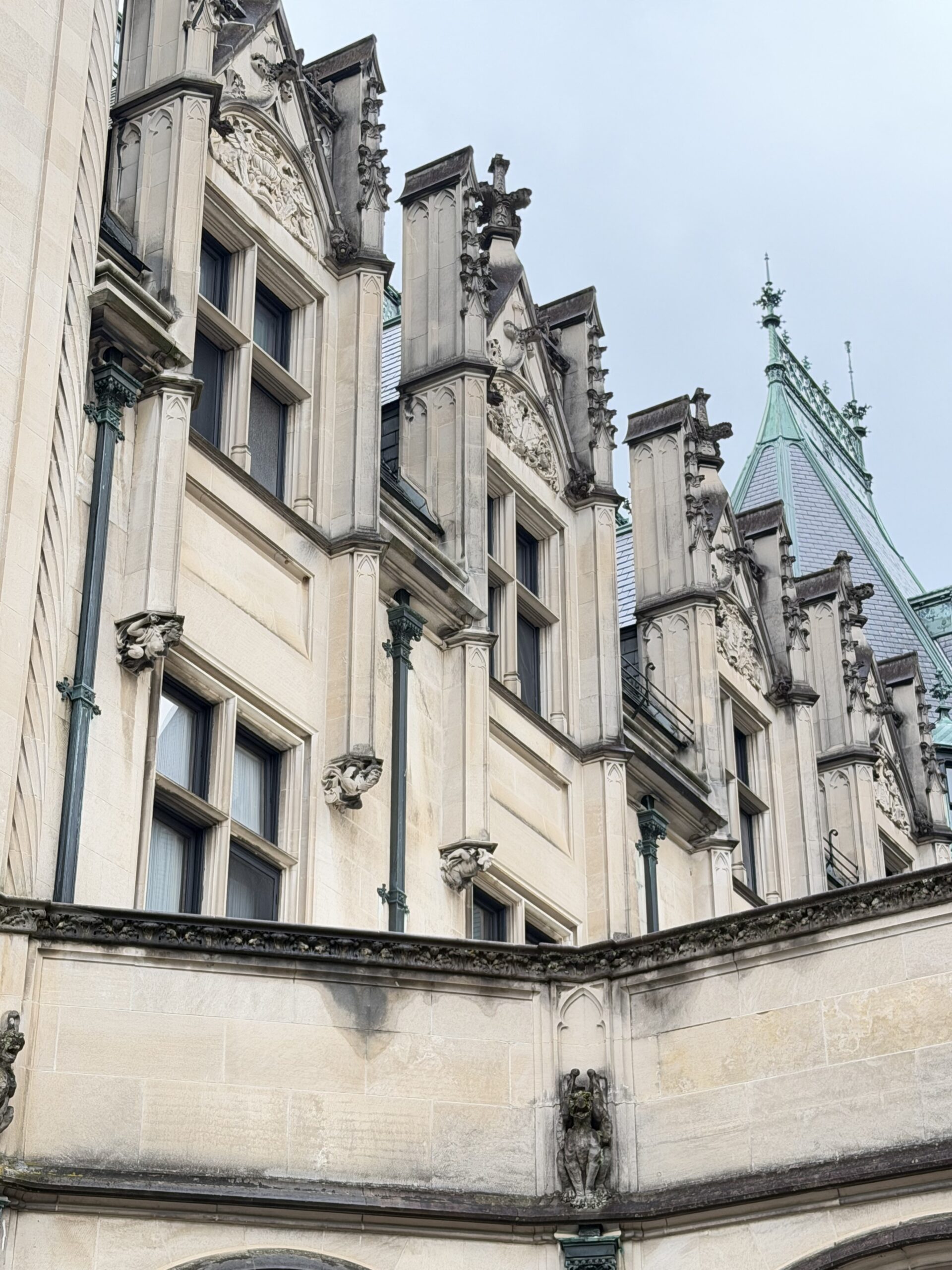 Close-up of Biltmore House's carved stone spires and rooftop details