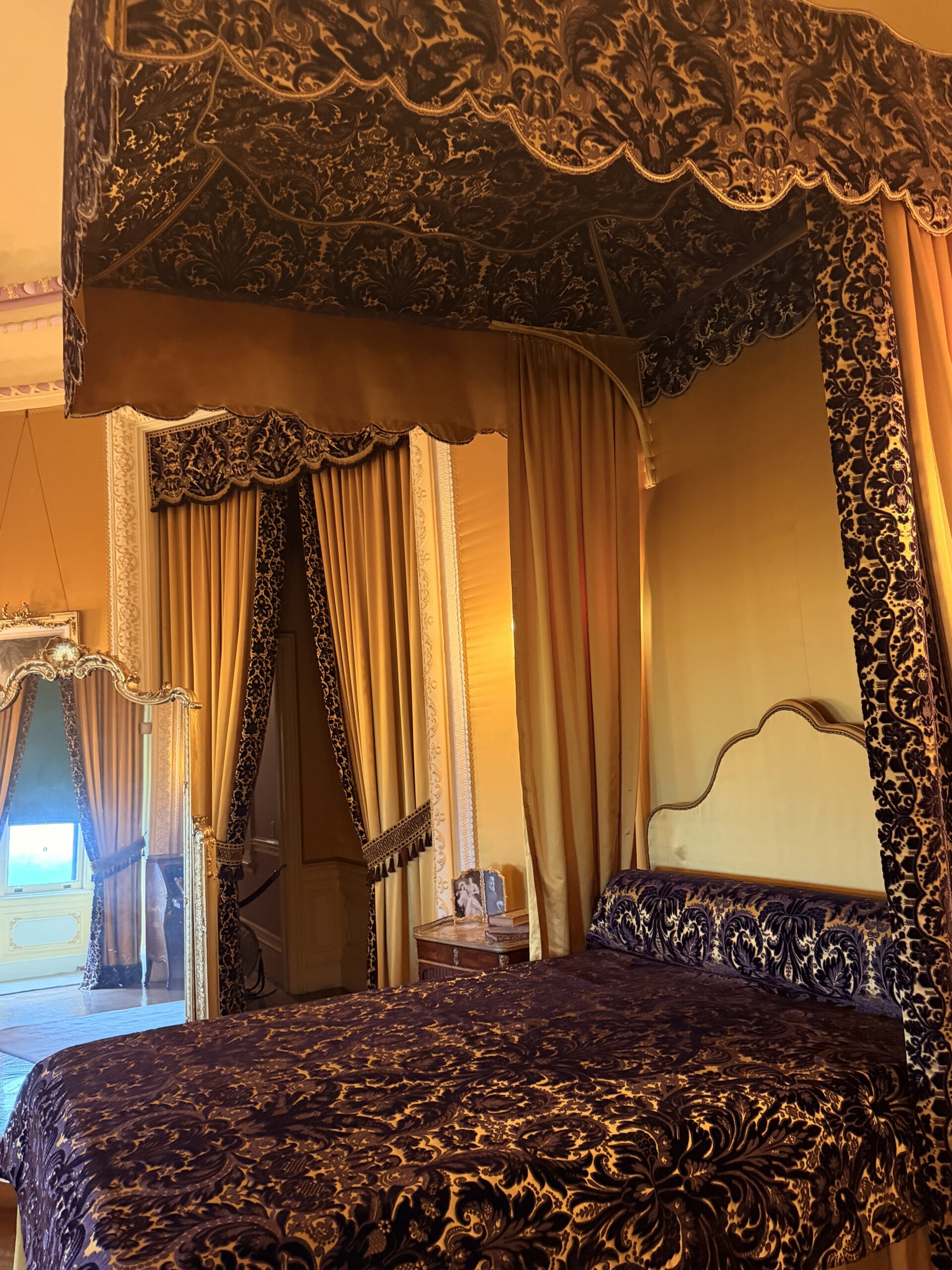 Gold damask canopy bed in one of Biltmore House's guest bedrooms
