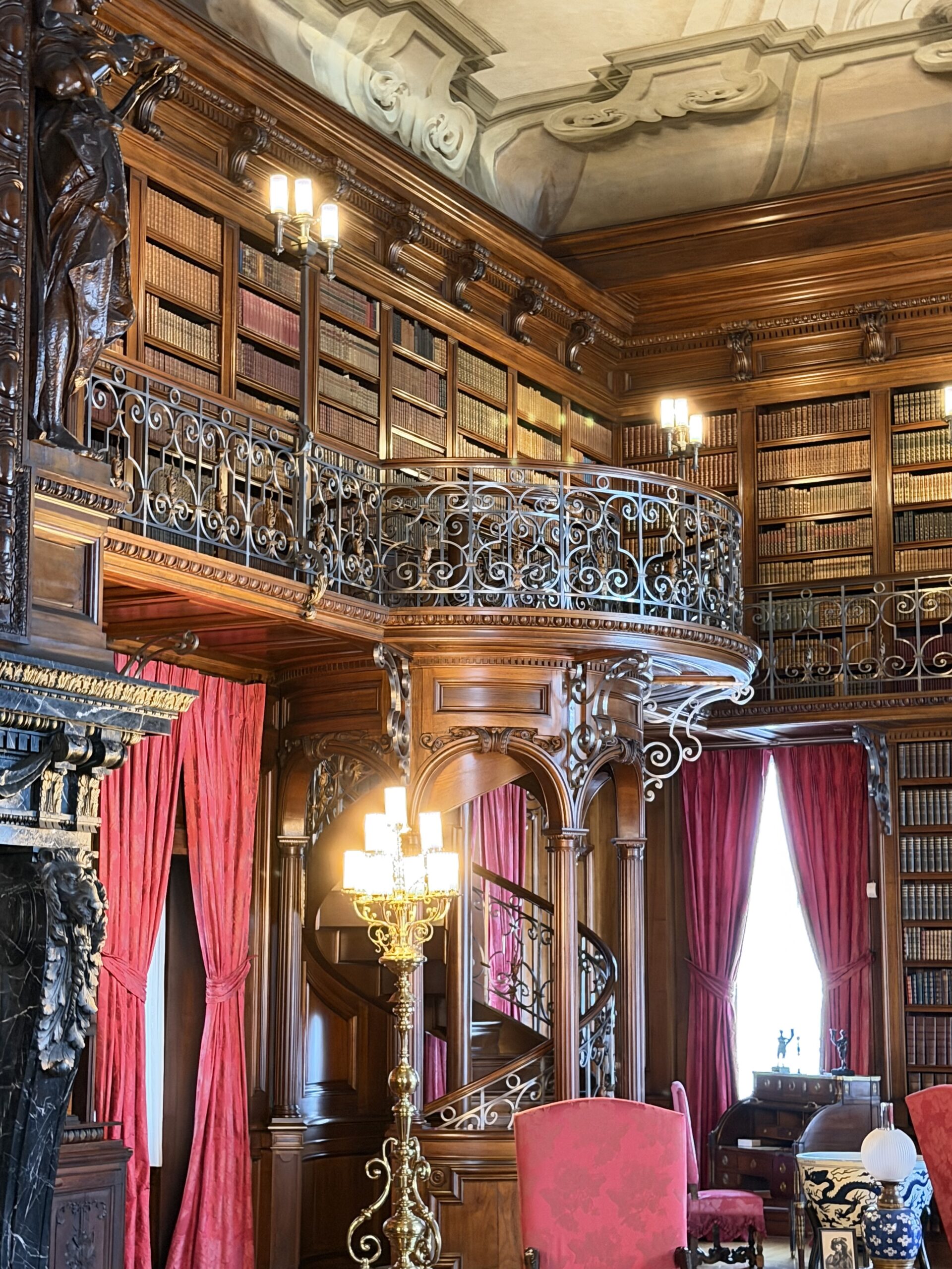Hidden spiral staircase tucked into the Library bookshelves at Biltmore House